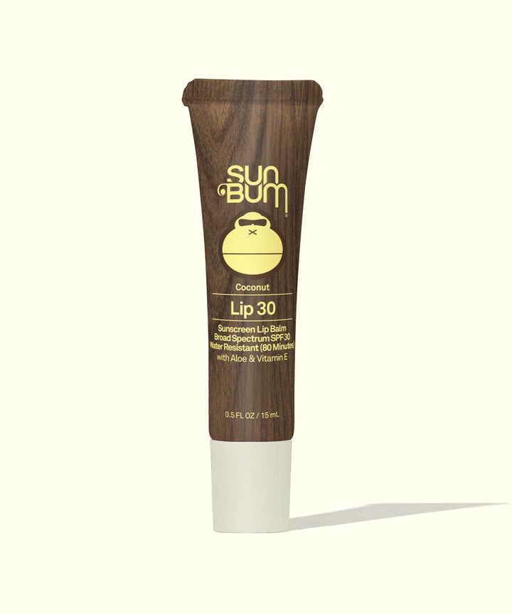 Coconut-flavored moisturizing lip balm with SPF 30 protection in a brown tube featuring Sun Bum logo and monkey icon, perfect for sun-safe hydration Sun Bum